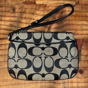 Coach classic monogram wristlet. See first and second photos for discoloration